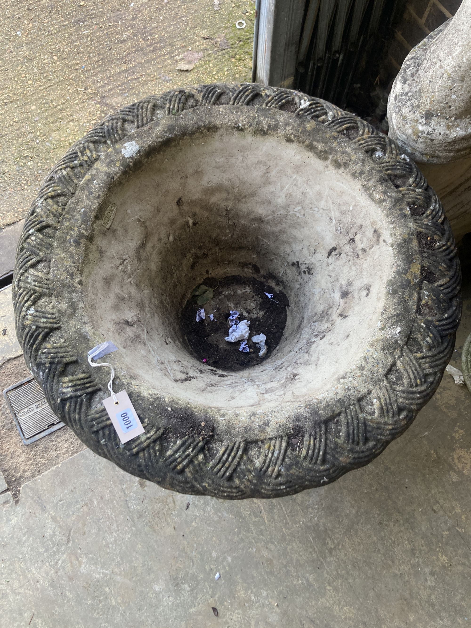 A large Lucas reconstituted stone garden planter on lions paw plinth foot, diameter 74cm, height 60cm